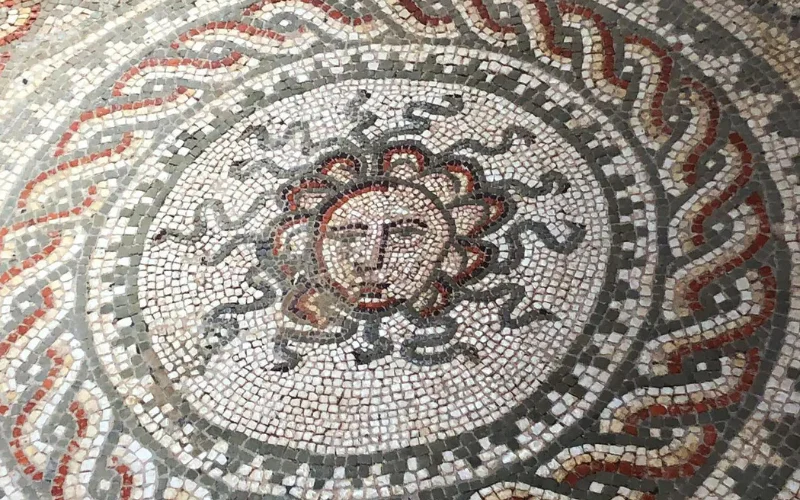 ruins of the gorgon head in Reggio Calabria, Versace Medusa logo, Versace logo history, Versace logo symbolism, Versace logo origin, meaning of Versace logo, Medusa head logo, Versace brand identity, Versace logo inspiration, Versace logo story, significance of Versace logo